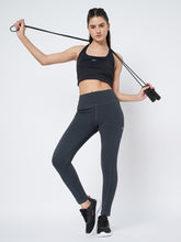 Waylene Dark Grey High-Rise Fitness Leggings with moisture-wicking fabric, shown with model holding a jump rope.