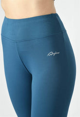 Close-up of Waylene Teal Blue Yoga Leggings, showcasing logo and dry-fit fabric.