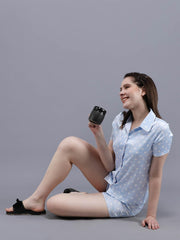 Waylene Navy Blue Printed Shirt & Shorts Set for Women, seated pose highlighting relaxed fit.