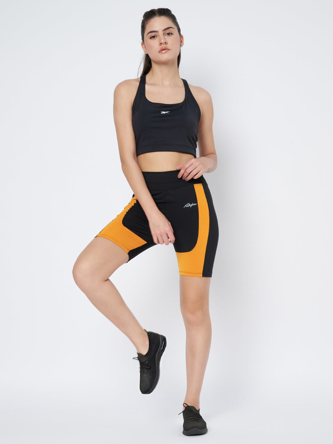 Waylene Black and Mustard Sports Shorts, full body front view with model standing
