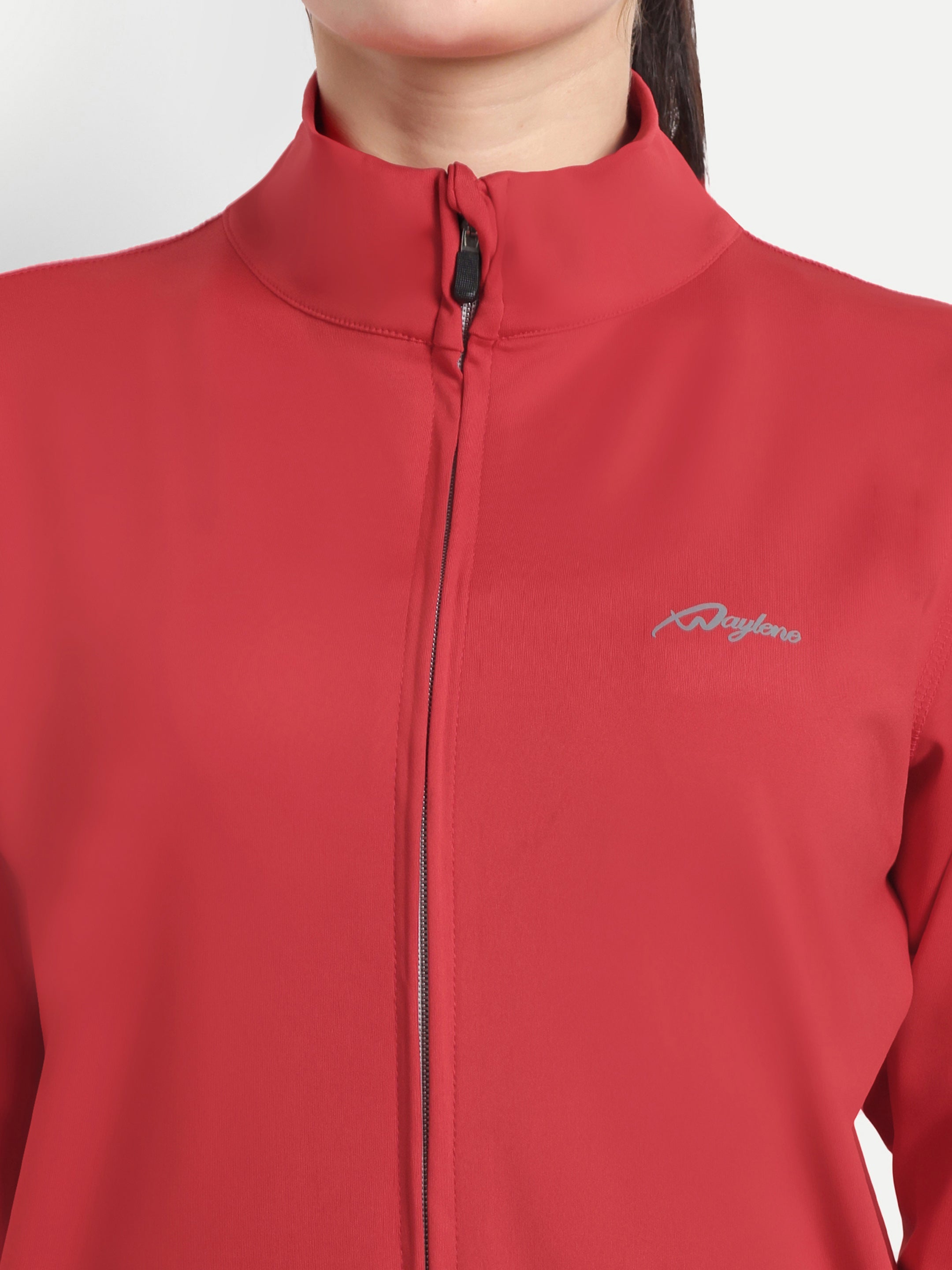 Close-up of Waylene Red Tracksuit jacket with zip and logo detail, showcasing moisture-wicking fabric.