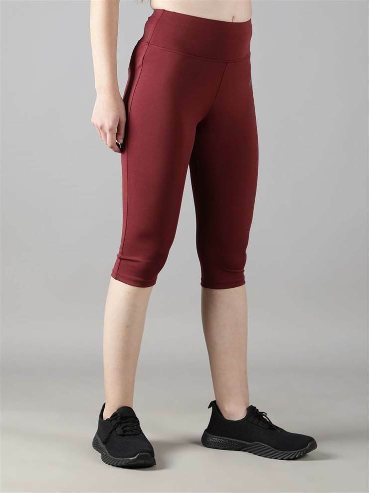 Waylene wine color capri tights, angled side view on model