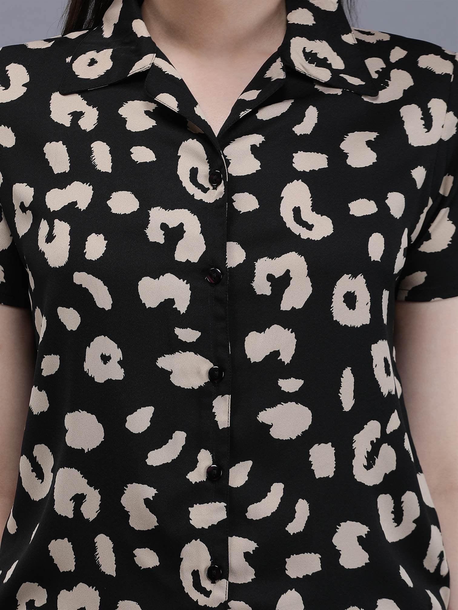 Close-up of Waylene Printed Shirt, button-down, black with beige abstract pattern.
