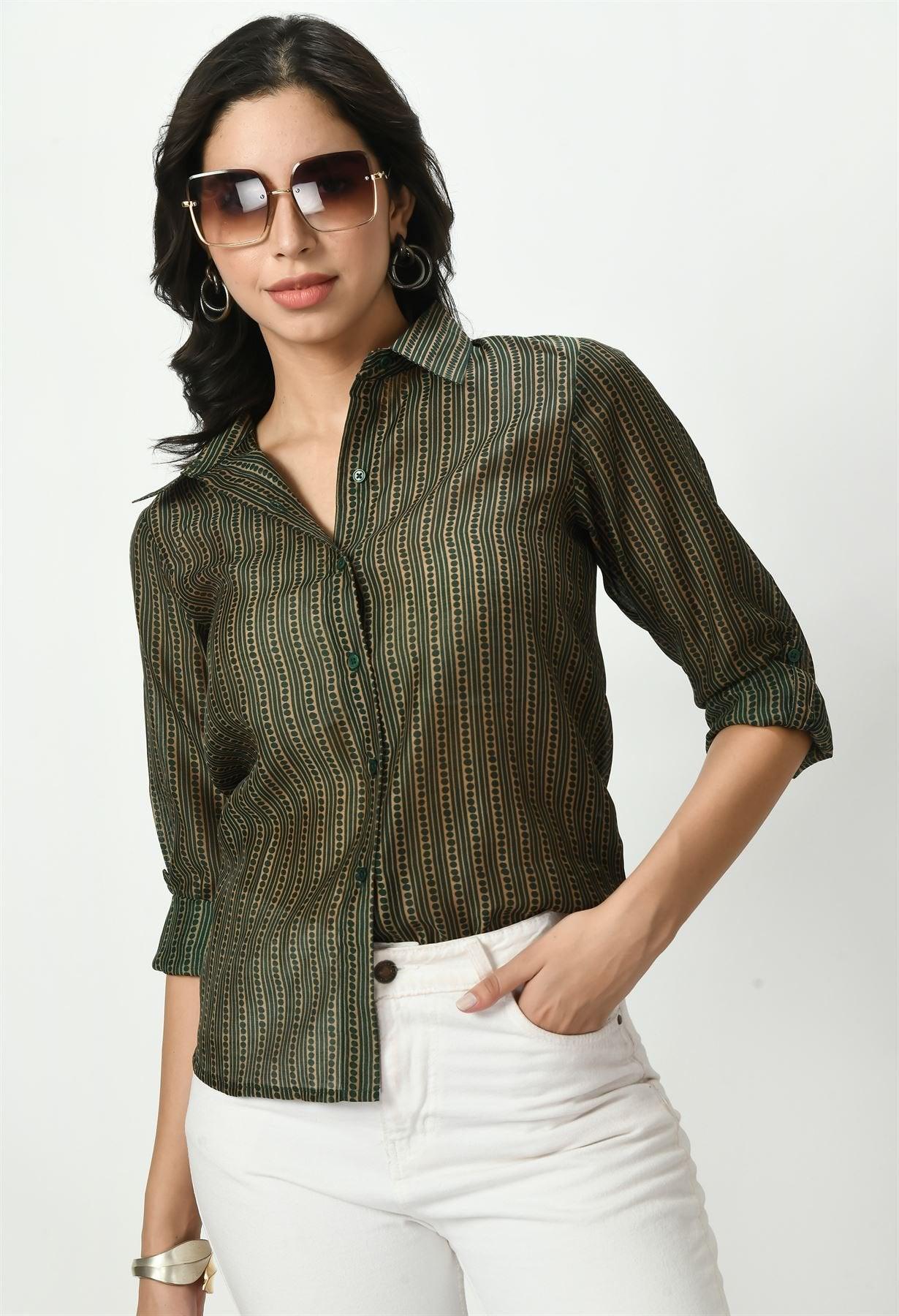 Waylene sheer green shirt styled with sunglasses and rolled-up sleeves.